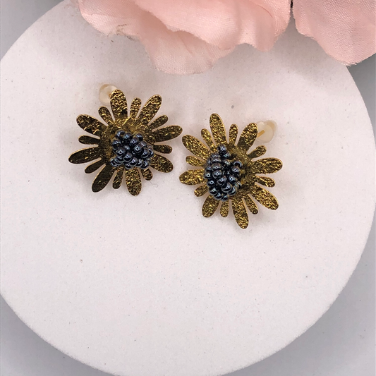 https://bellalujewelry.com/products/bronze-handmade-vintage-flower-shape-colombian-earrings-1