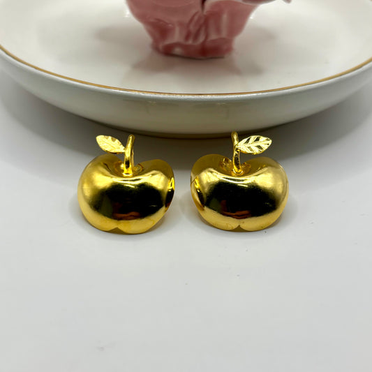 Whimsical apple-shaped earrings with a playful, colorful design