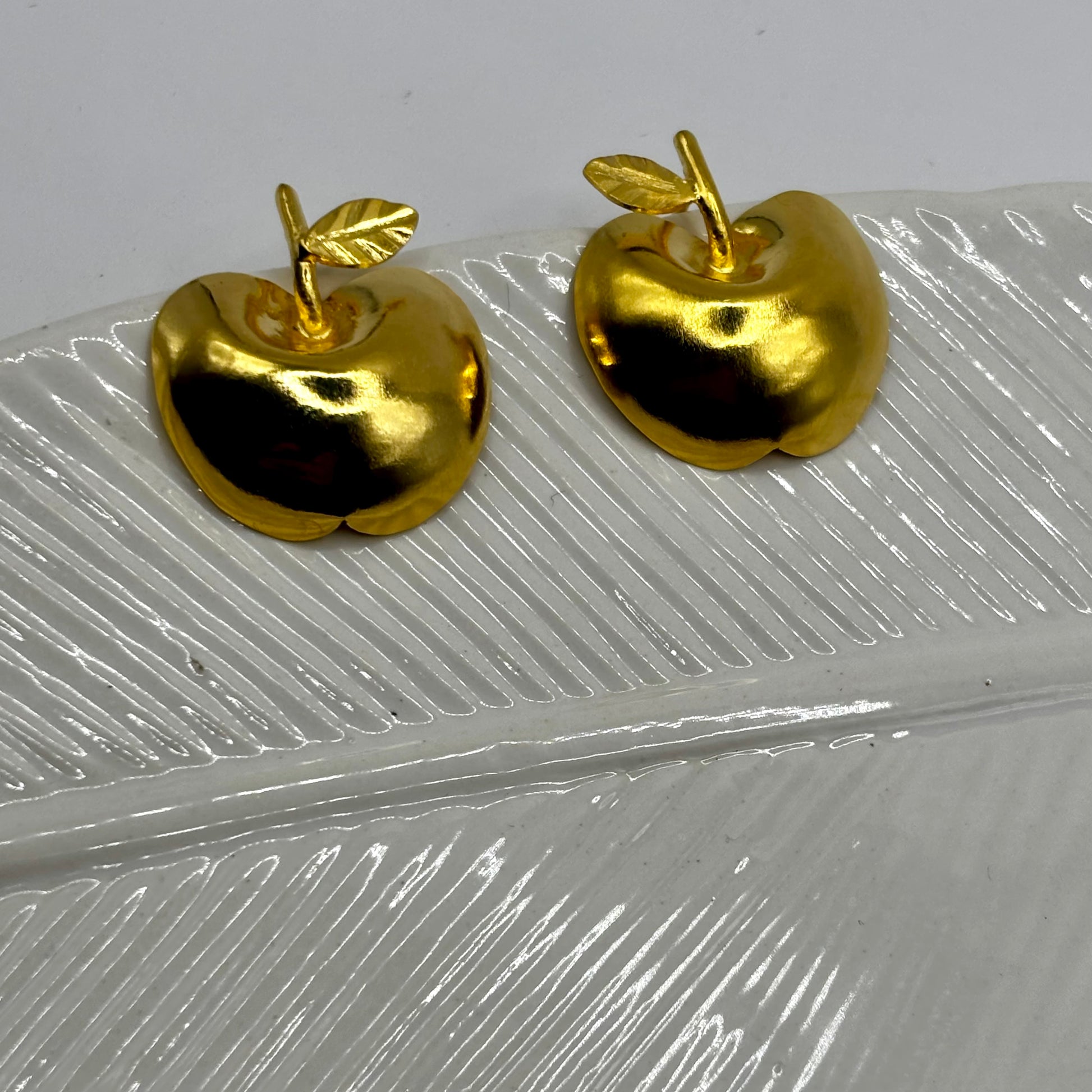 Whimsical apple-shaped earrings with a playful, colorful design