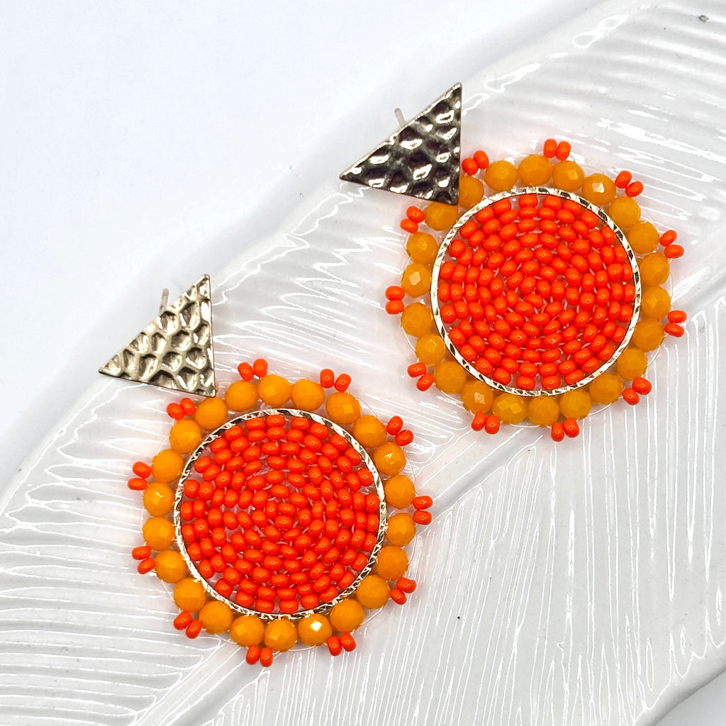 Orange
A pair of elegant Kara Earrings with a sleek, modern design, perfect for any occasion.