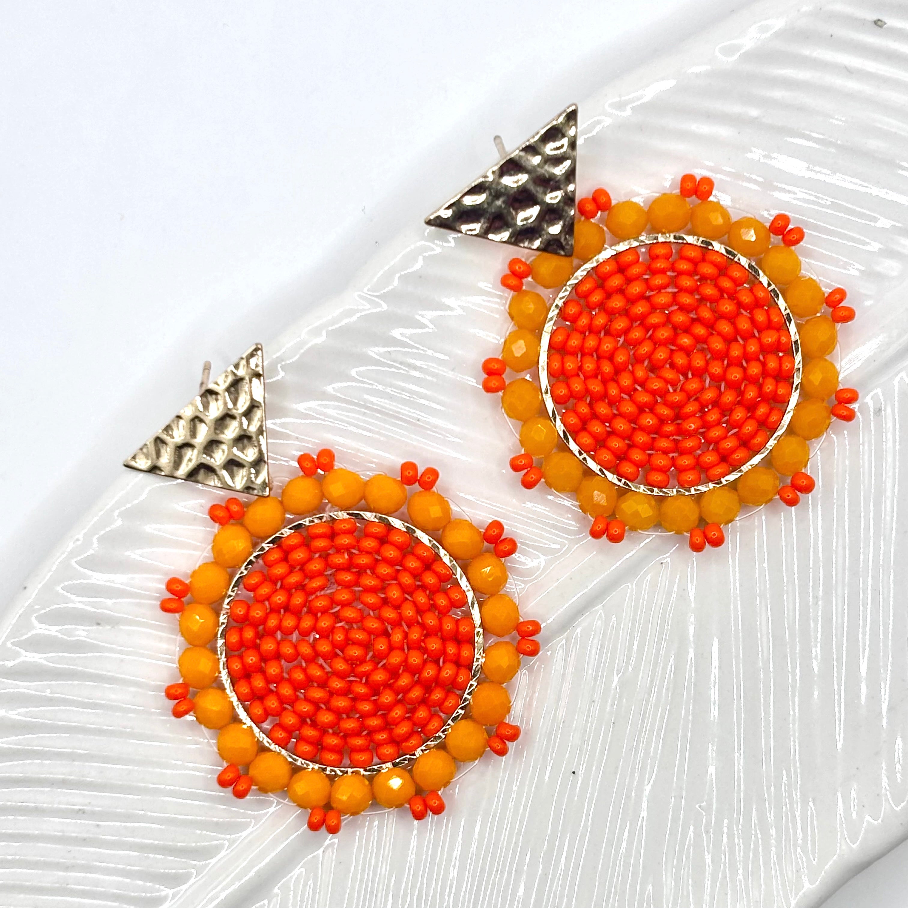 Orange
A pair of elegant Kara Earrings with a sleek, modern design, perfect for any occasion.