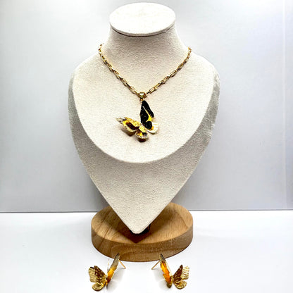 Butterfly-themed necklace and earrings on a mannequin bust with a white background