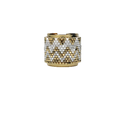 Gold and silver beaded ring on a white background