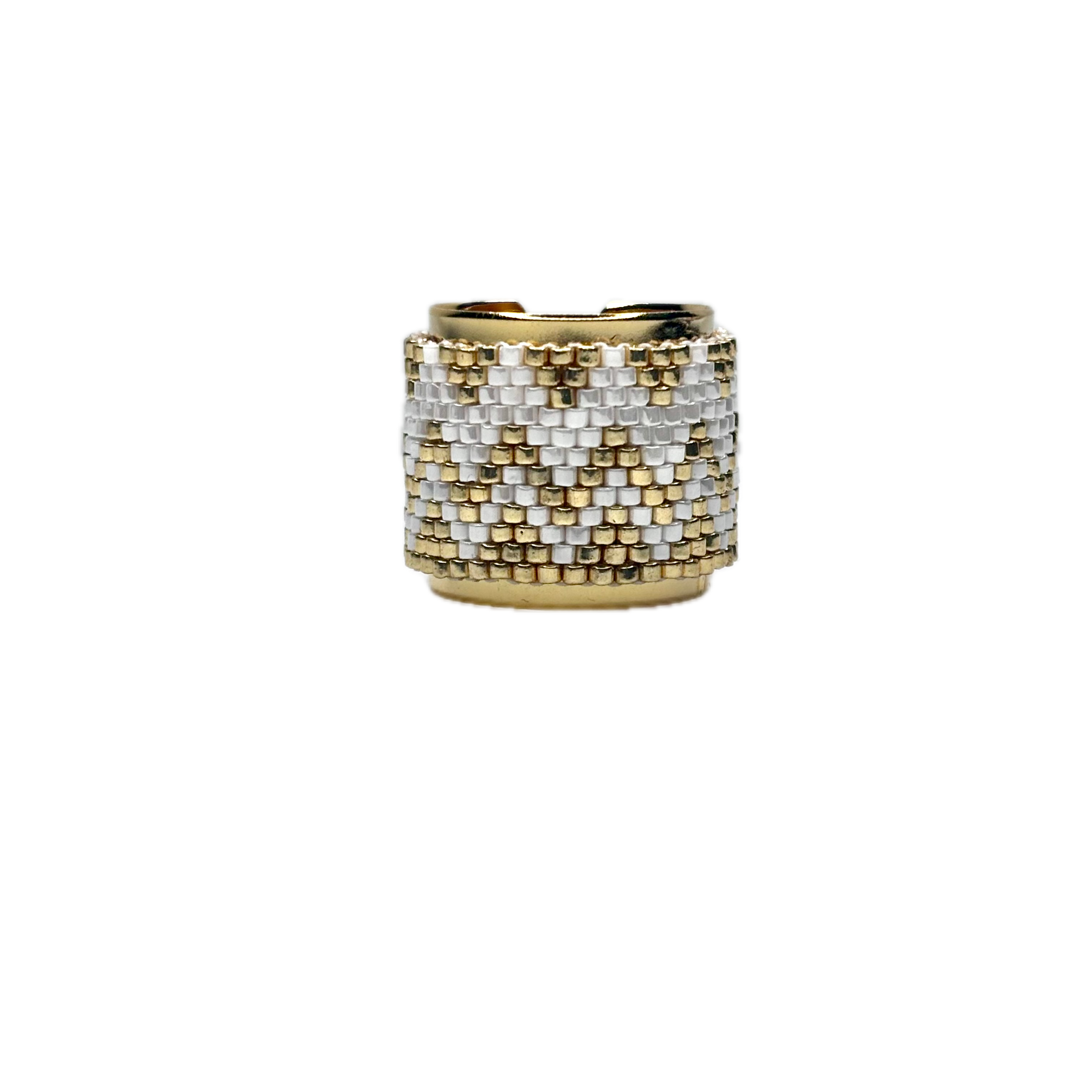 Gold and silver beaded ring on a white background