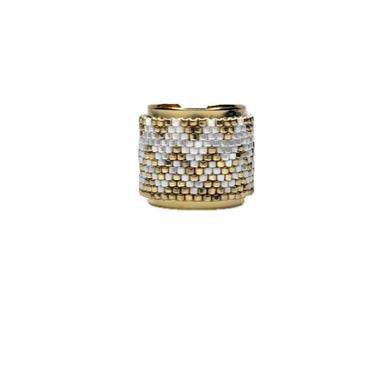 Gold and silver beaded ring on a white background
