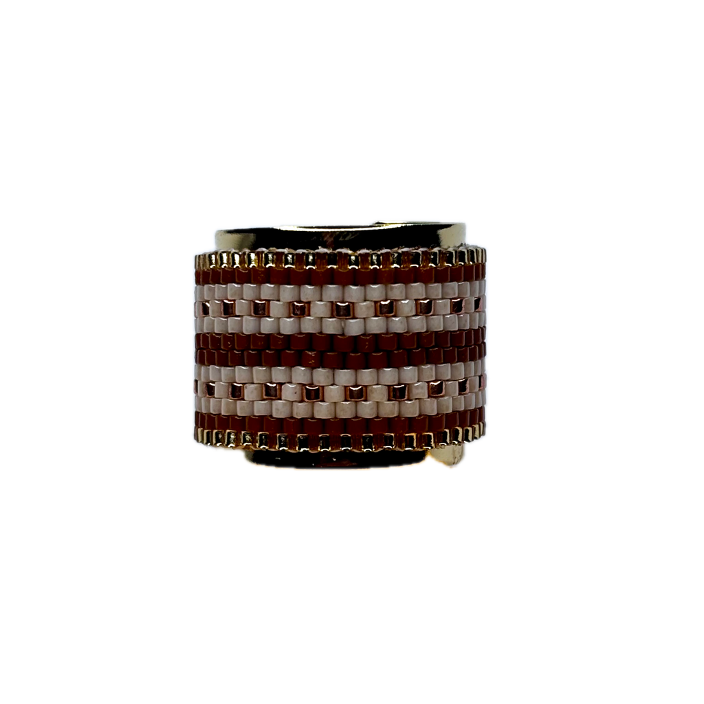 Ring with brown and white woven pattern on a white background