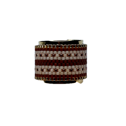 Ring with brown and white woven pattern on a white background