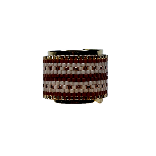 Ring with brown and white woven pattern on a white background