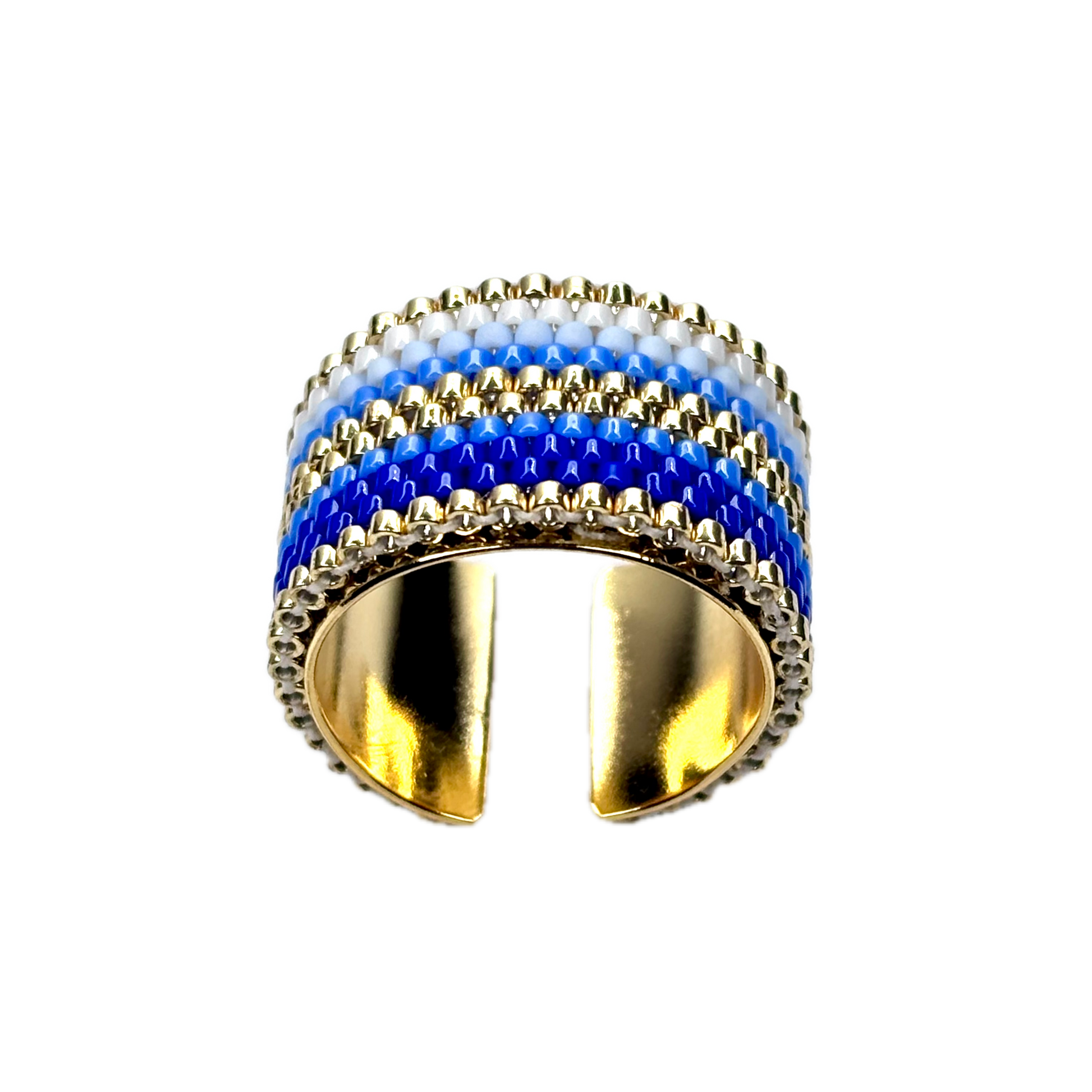 Gold ring with blue and white striped design on a black background