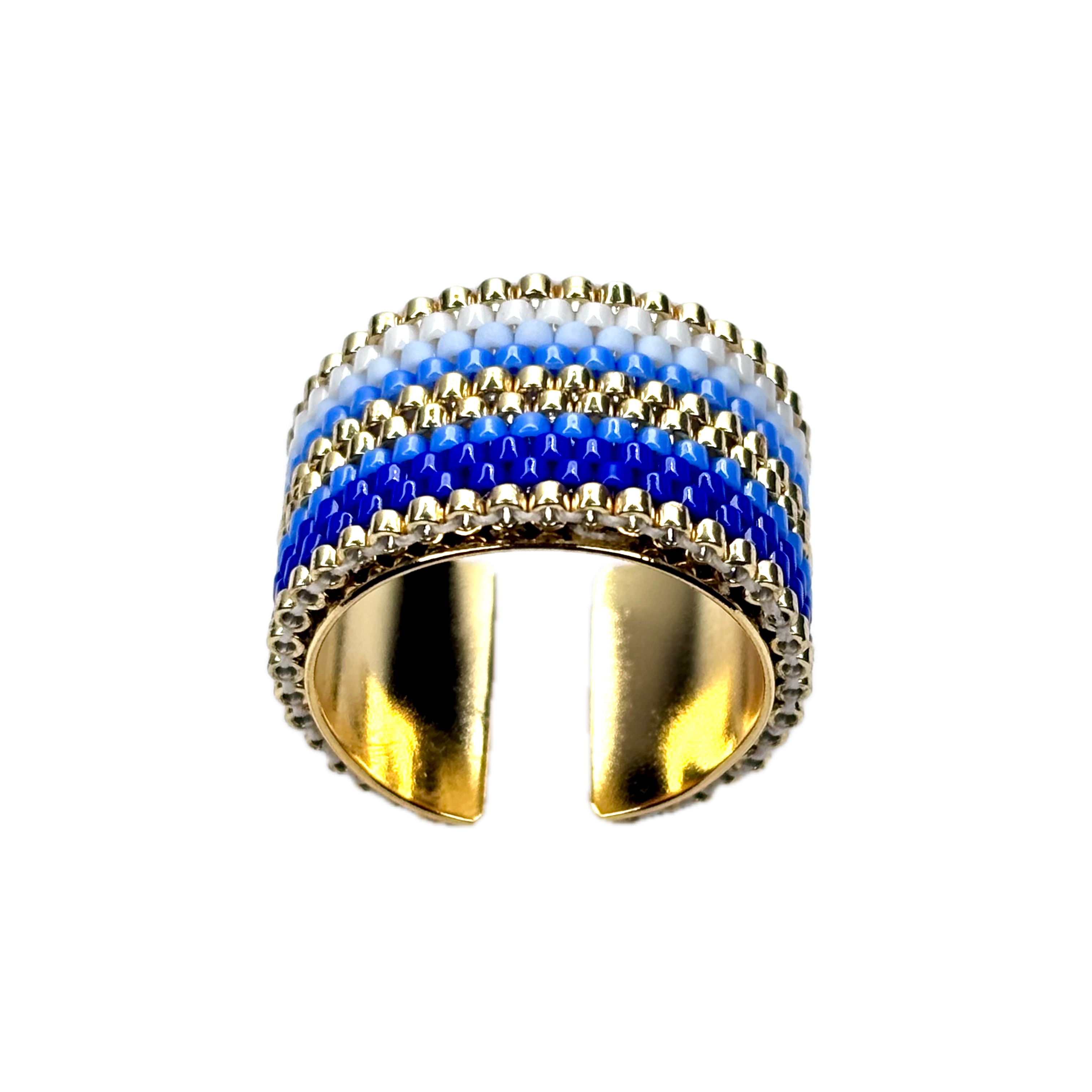 Gold ring with blue and white striped design on a black background