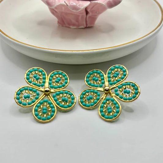 Periwinkle Earrings featuring a delicate floral design with a polished finish, inspired by the beauty of the Periwinkle flower for a timeless and elegant look.