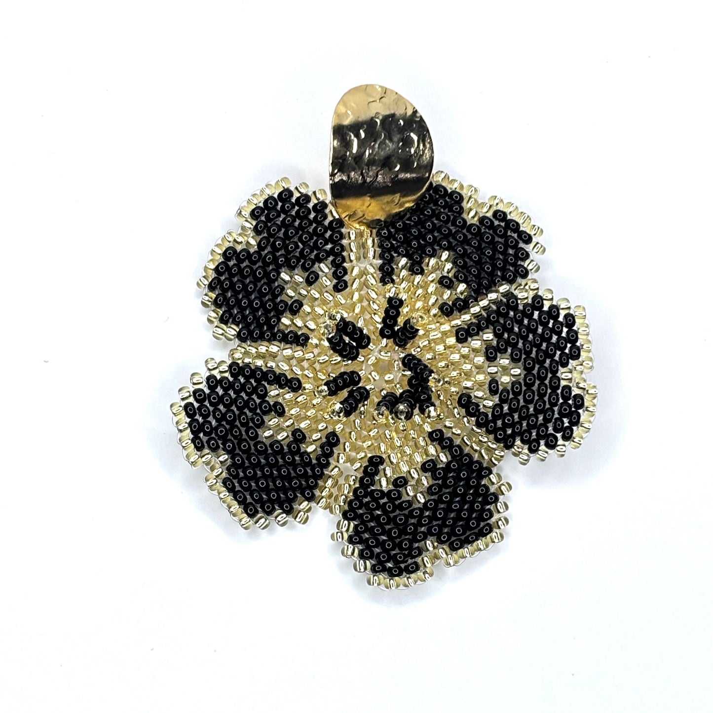 Gold and black beaded flower-shaped earring on a white background