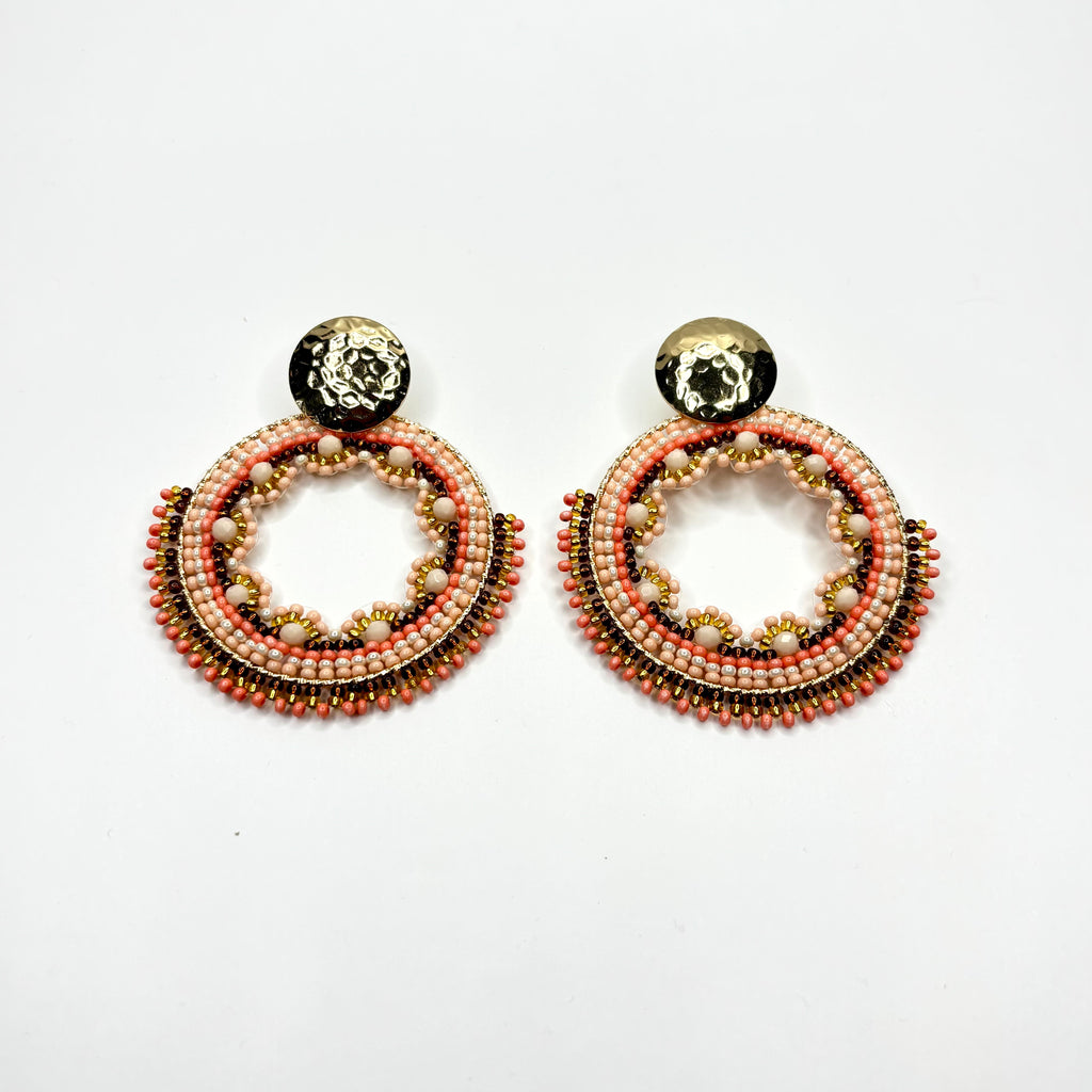 Pair of beaded earrings on a white background