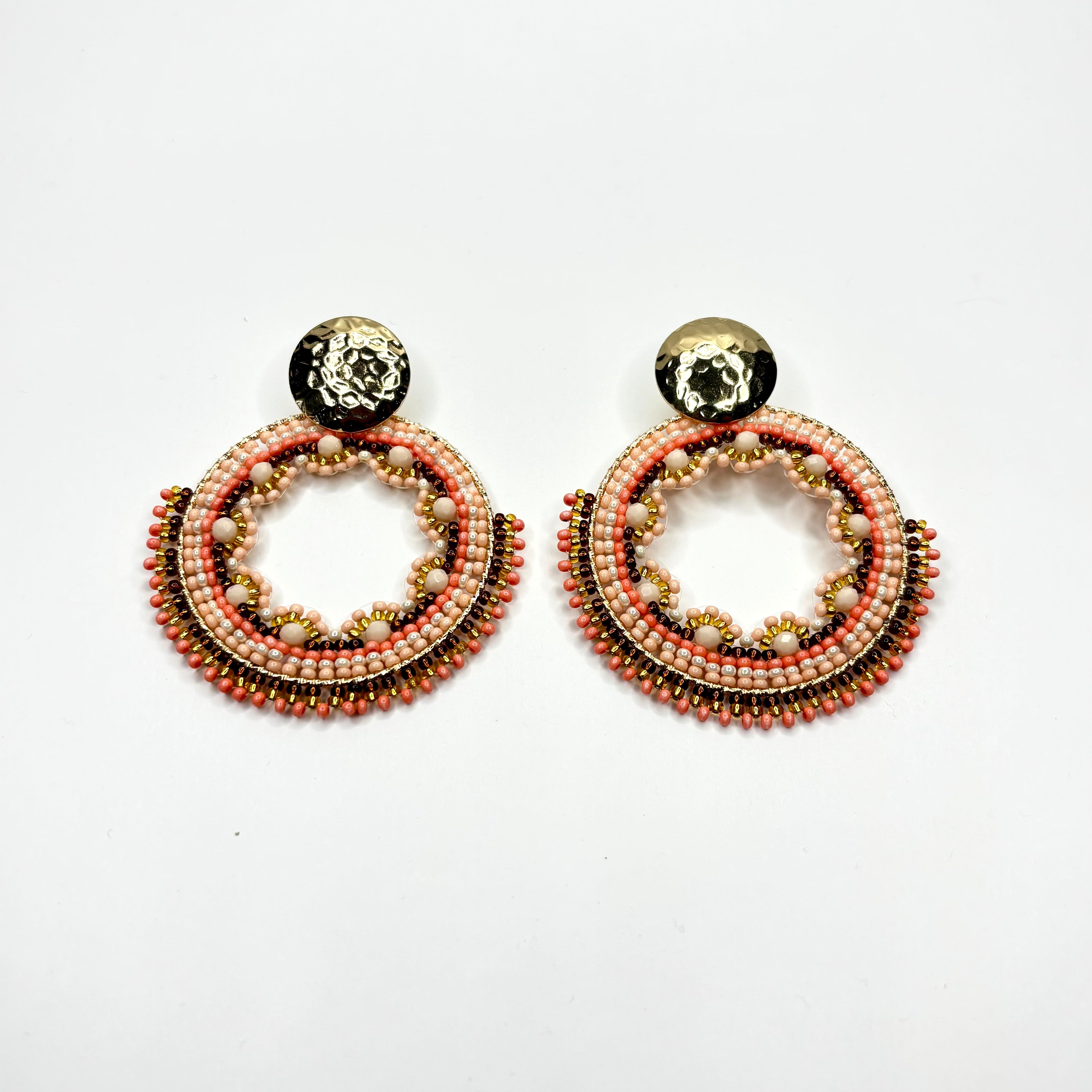 Pair of beaded earrings on a white background