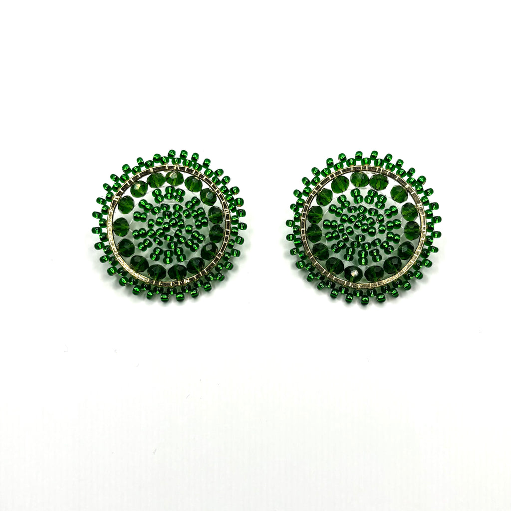 Pair of green beaded earrings on a white background