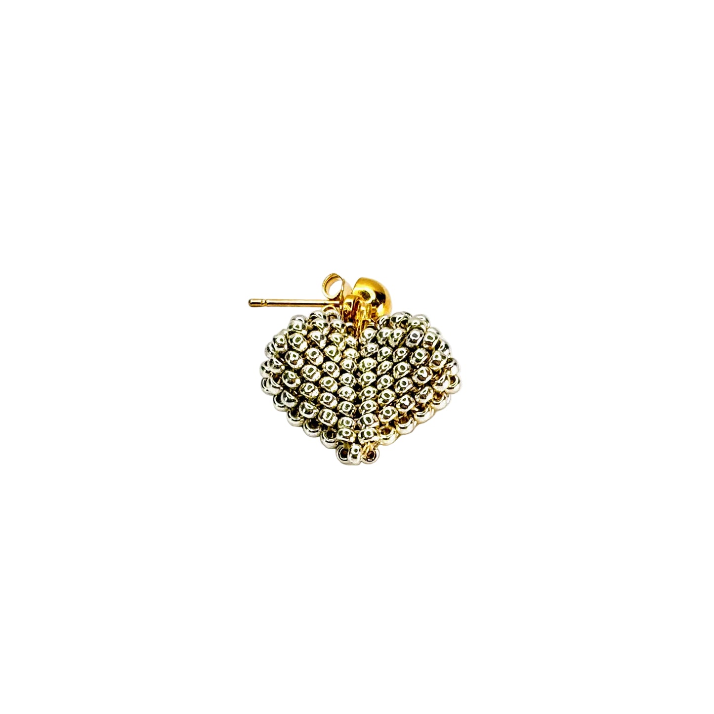 Gold heart-shaped earring on a white background